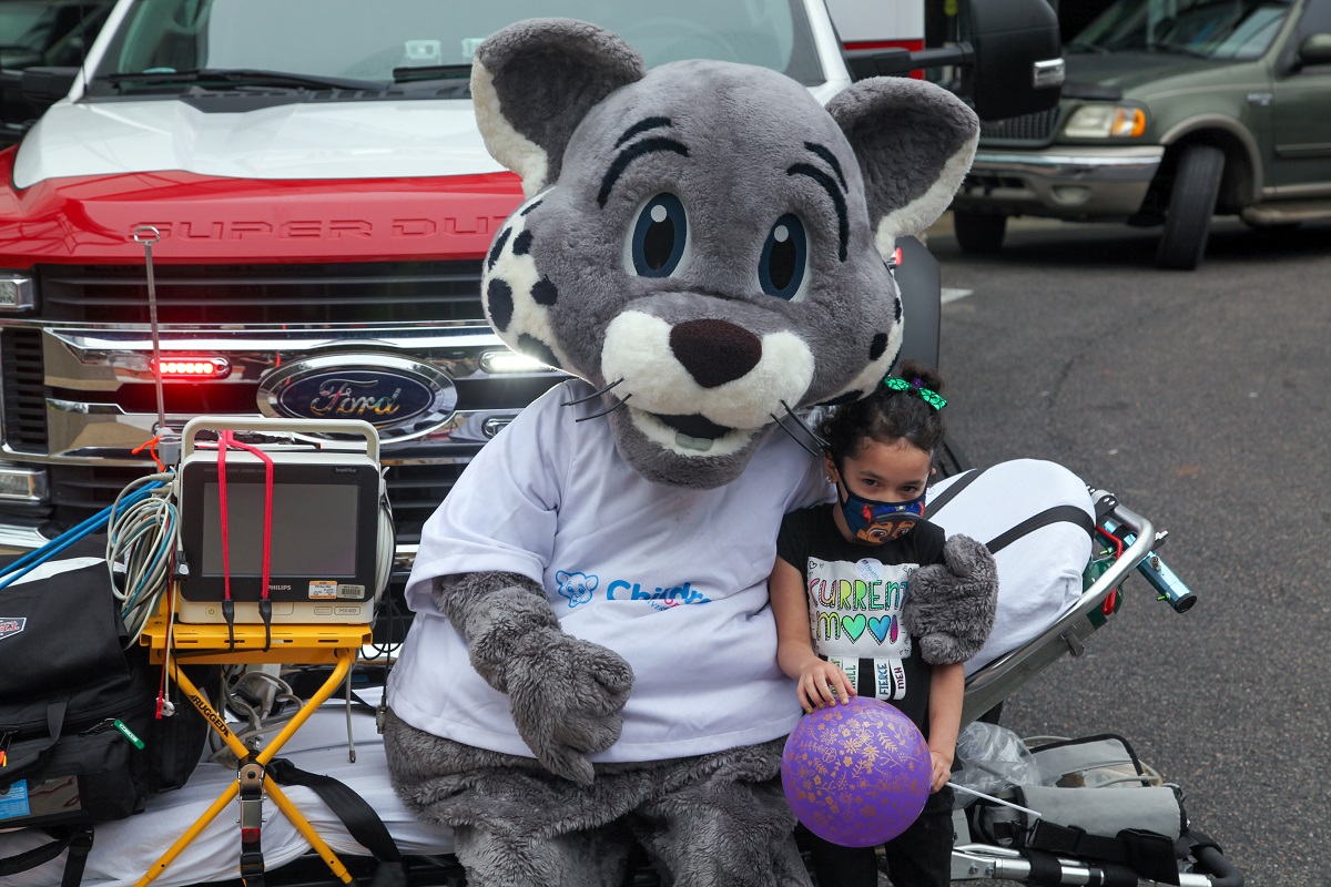 CHOG mascot with young girl