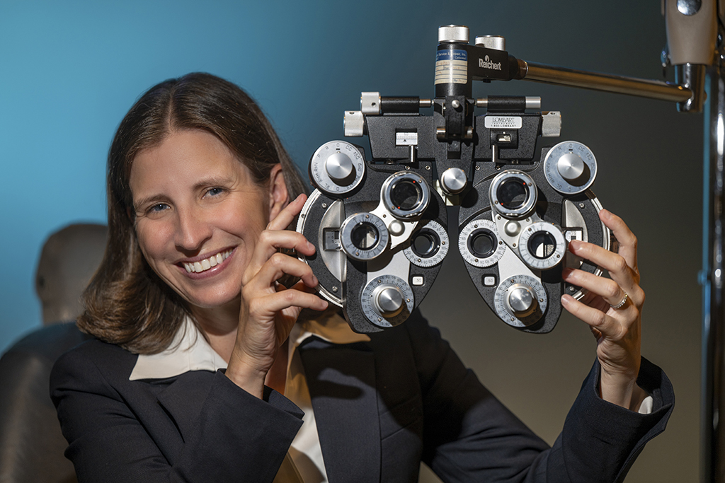 Woman holding ophthalmology equipment in her hands
