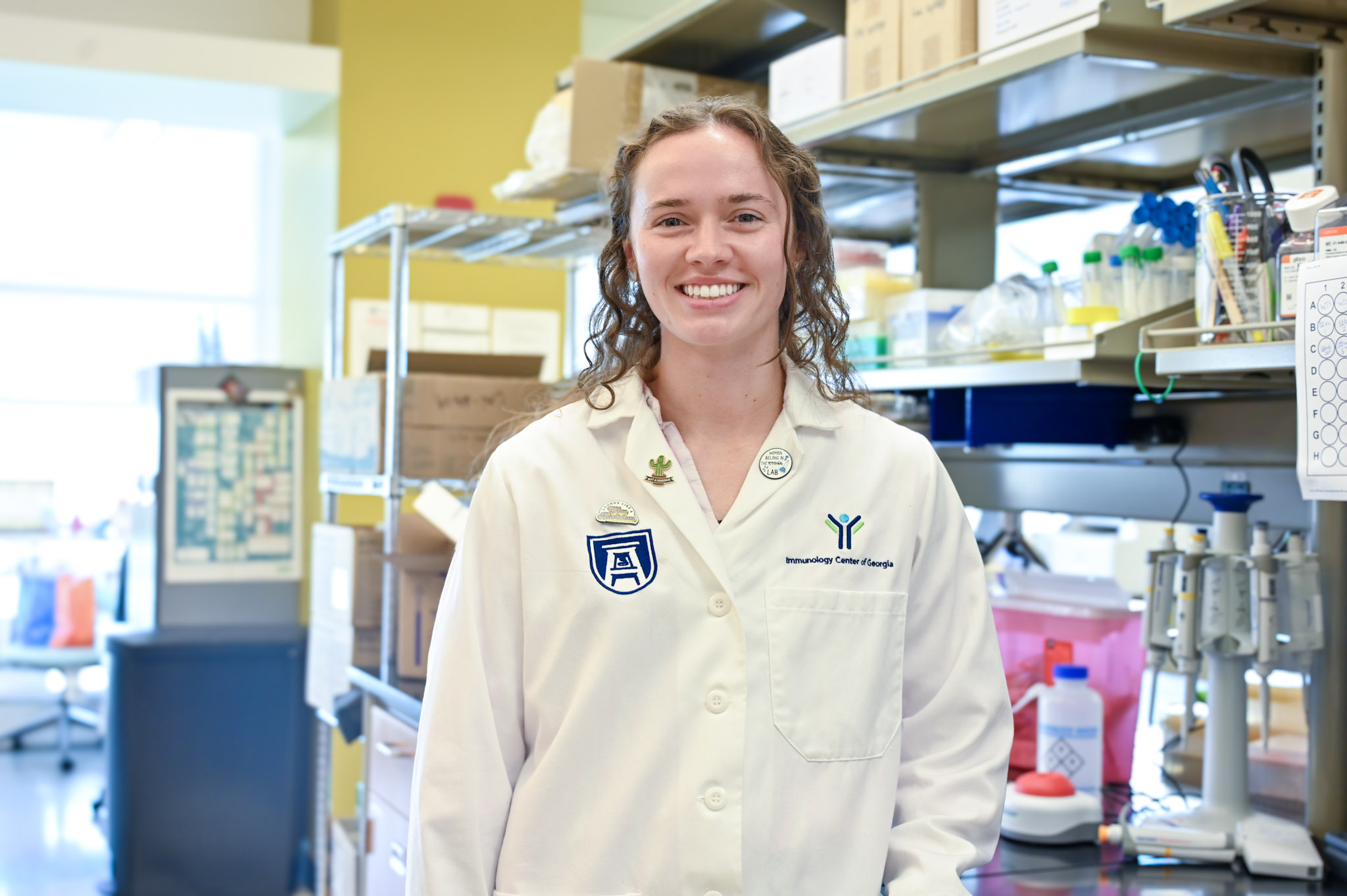 young woman in white lab coat