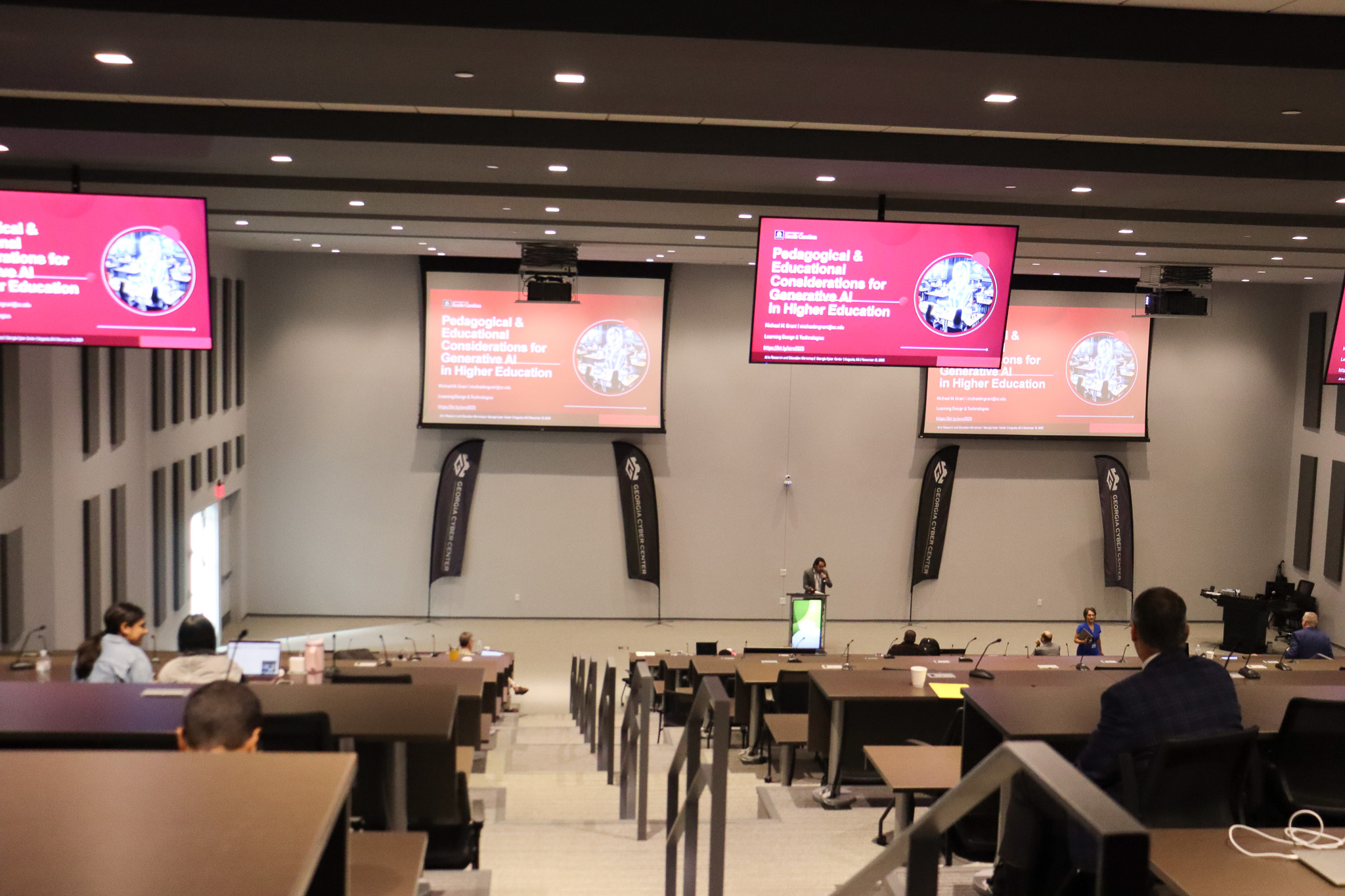 A large classroom in a modern building on a college campus.