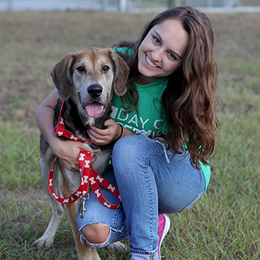 Student with dog on day of service.