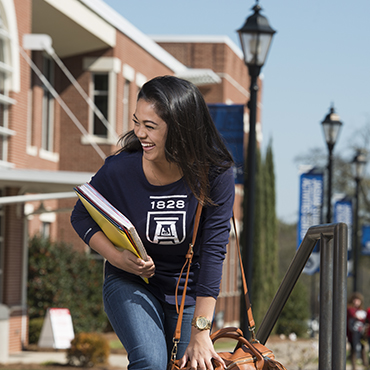 Student wearing jagswag on campus.