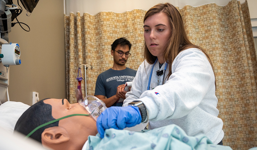 Nursing Student directs people at health fair