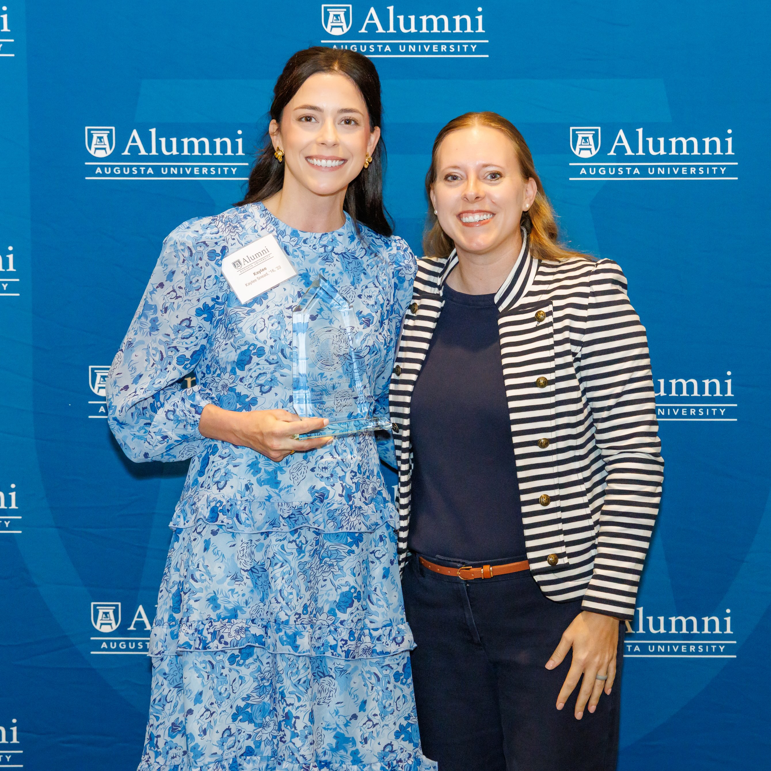 Kaylee Snead accepting the 2025 Outstanding Young Alumni  award