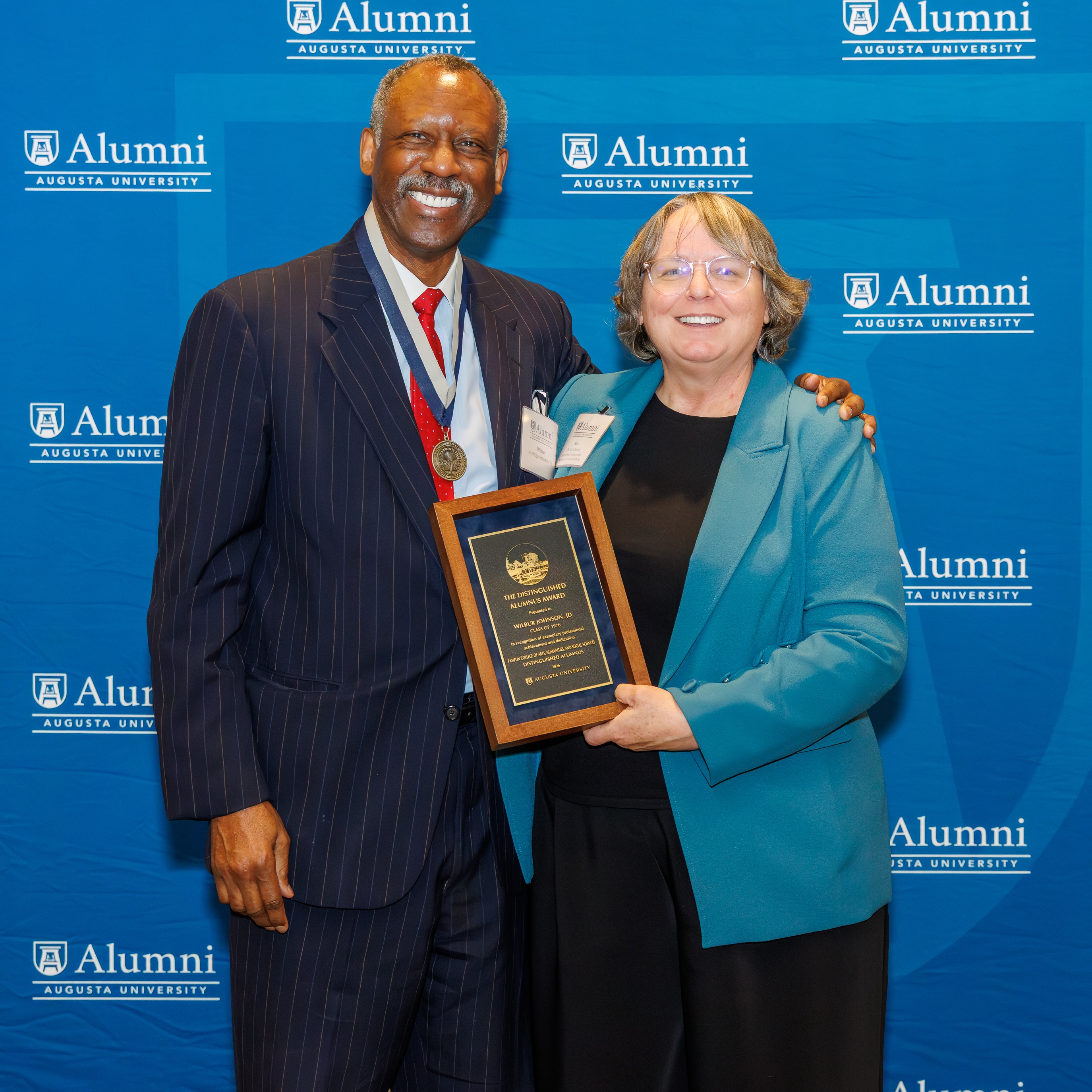 Wilbur Johnson accepting Distinguished Alumni award