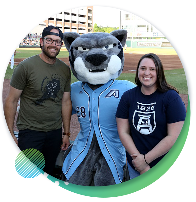 Alumns with Augustus at a Greenjackets game