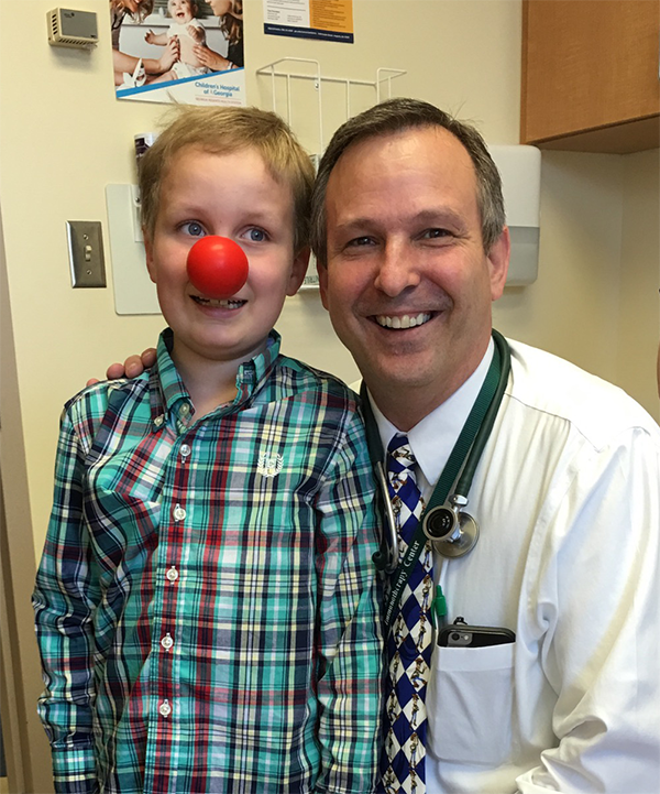 Dr. Ted Johnson with clinical trial patient