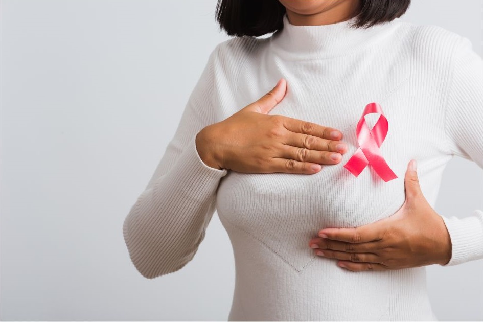 woman with cancer ribbon on chest