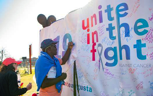 Man writing on banner