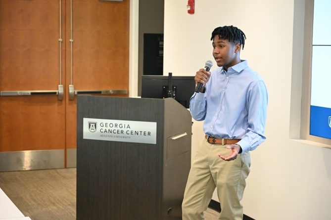 2023 GCC SRE participant giving his oral presentation on his research project during the Celebration Ceremony