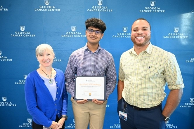 2023 GCC SRE participant receiving his certificate of completion during the Celebration Ceremony