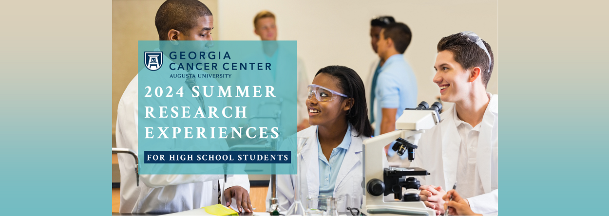 Georgia Cancer Center at Augusta University. 2023 Summer Research Experiences for High School Students. Contains an image of students in white coats using a microscope and sitting talking together in a lab.