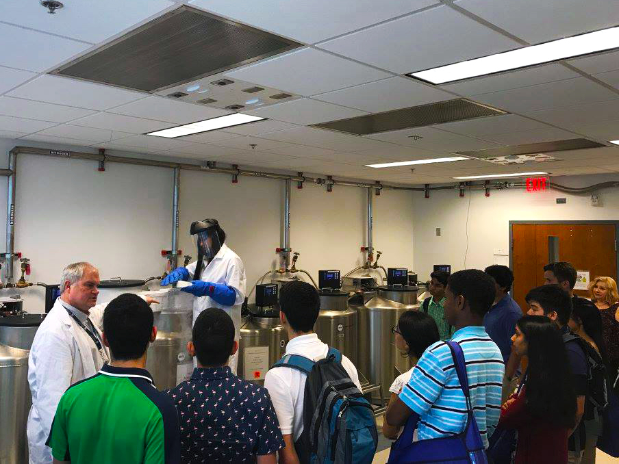Students standing in research laboratory