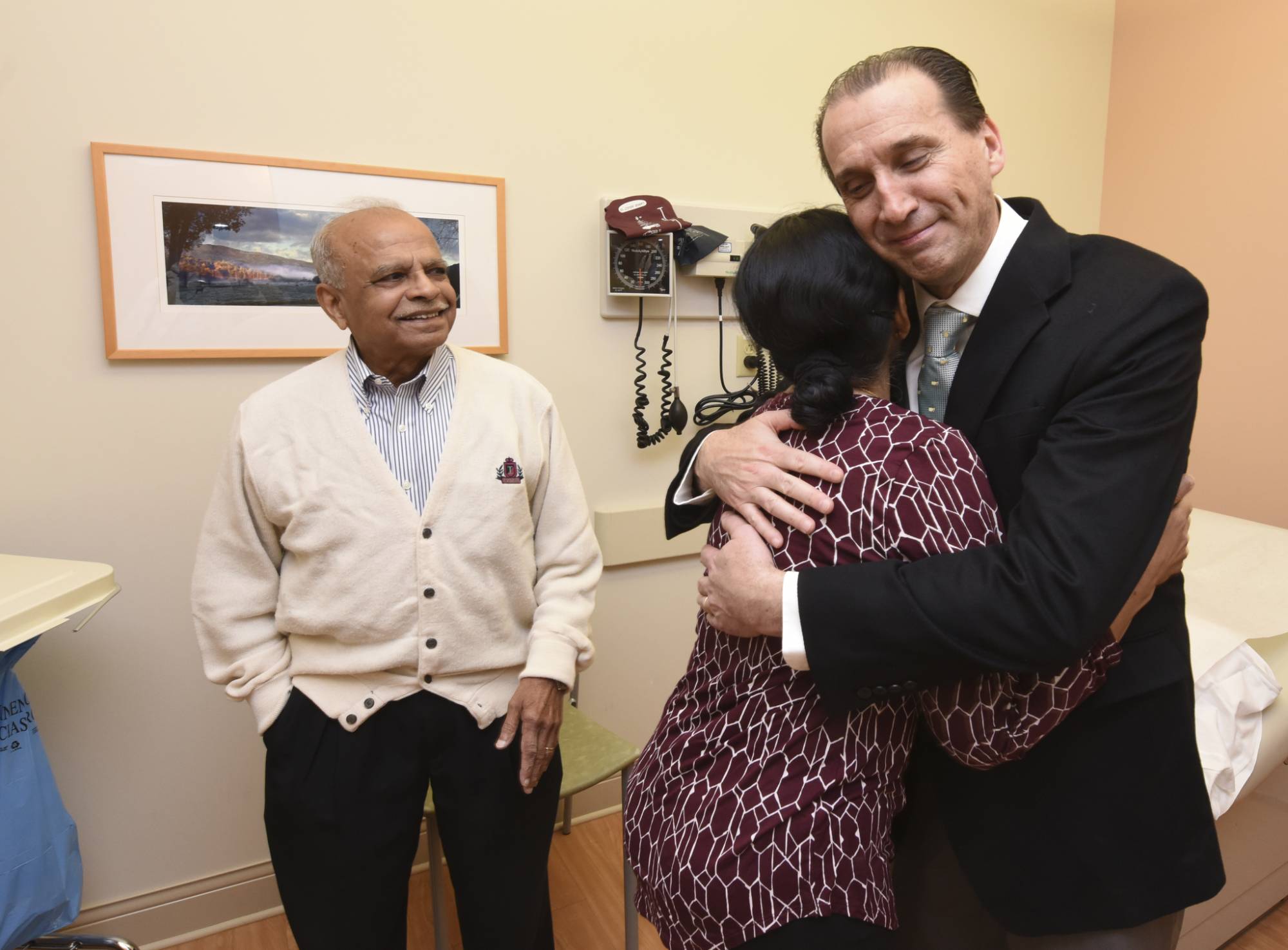 Dr. Daniel Albo hugs patient during visit