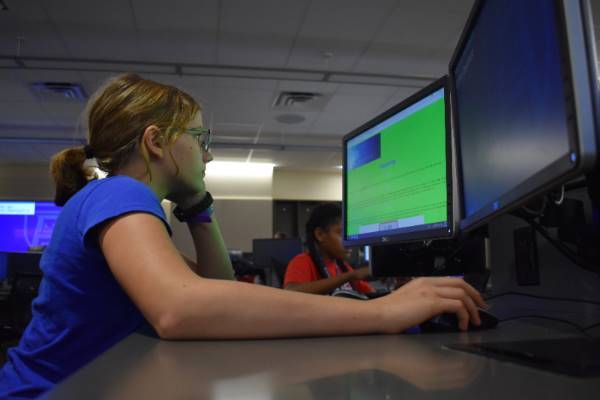 Girls Who Code student working on computer 