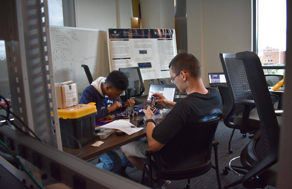 students working together on robot 