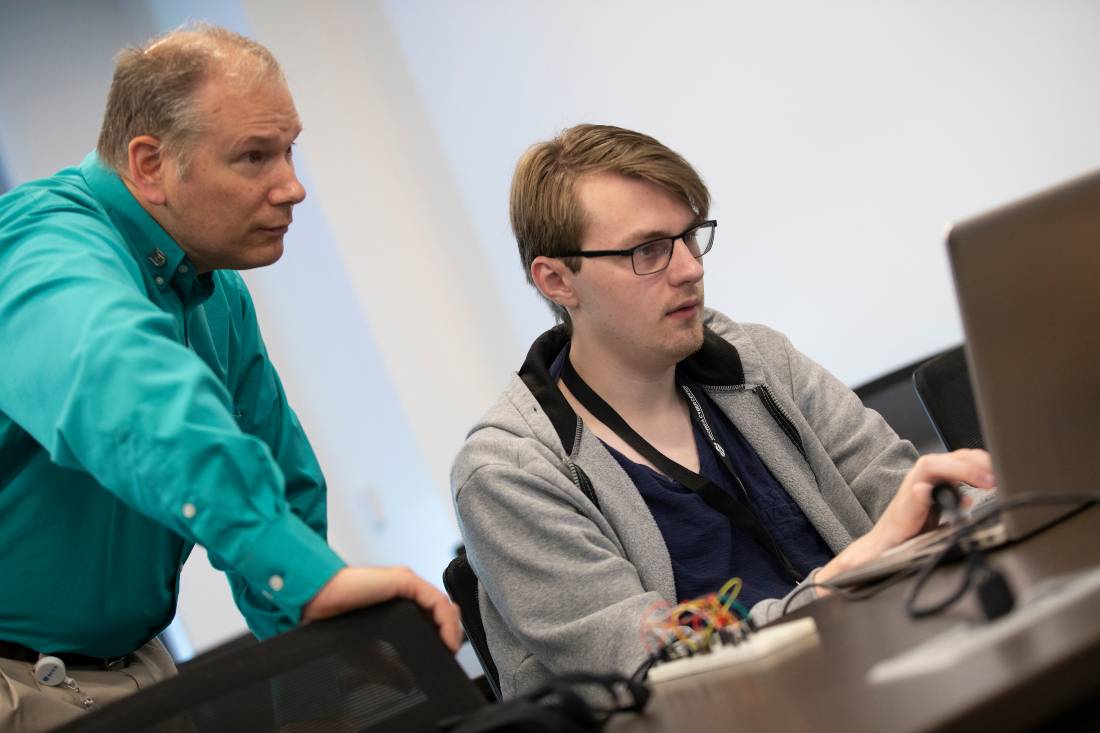 Professor working with student 