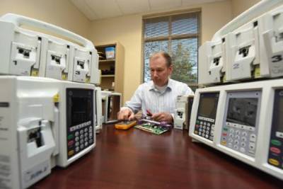 Professor working with devices 