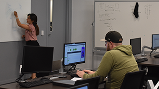 Computer science classroom with professor and students