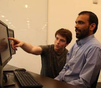 CCS students sitting at computer 