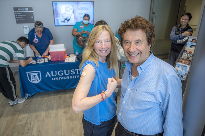 Two people at flu clinic