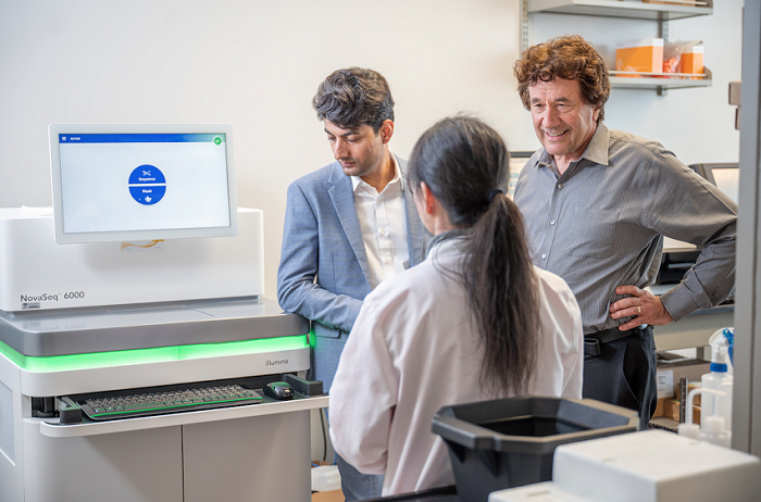 Dr. Klaus and lab members with Nova seq.