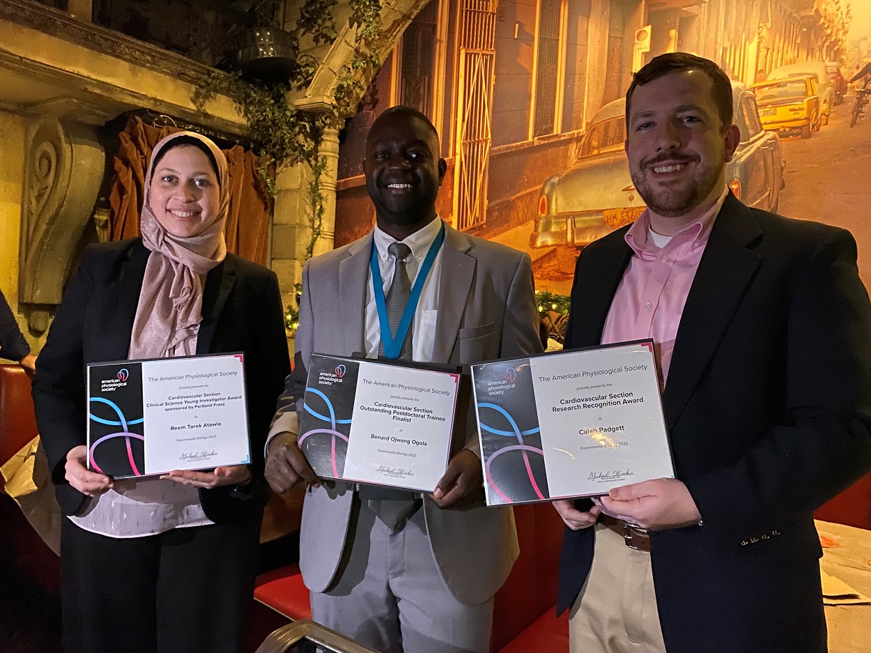 Reem Atawia, Benard Ogola and Caleb Padgett pose with their EB 2022 awards