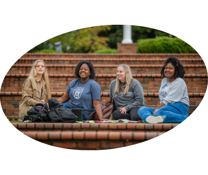 Students sitting on the green