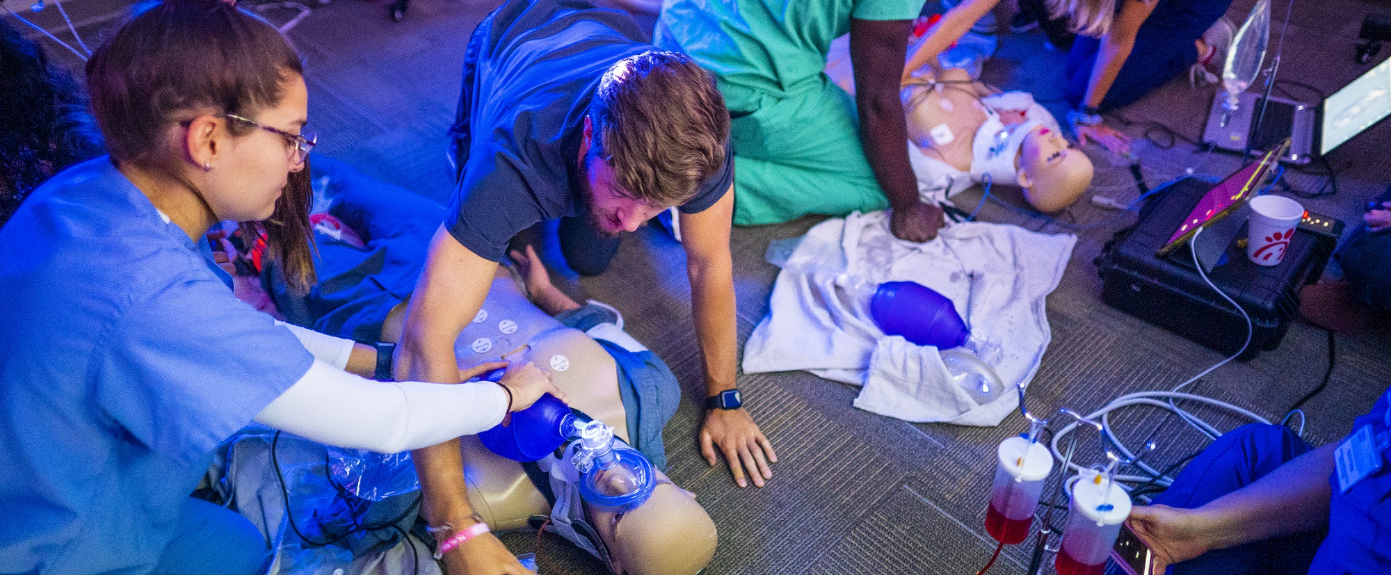 Students working with medical dummies