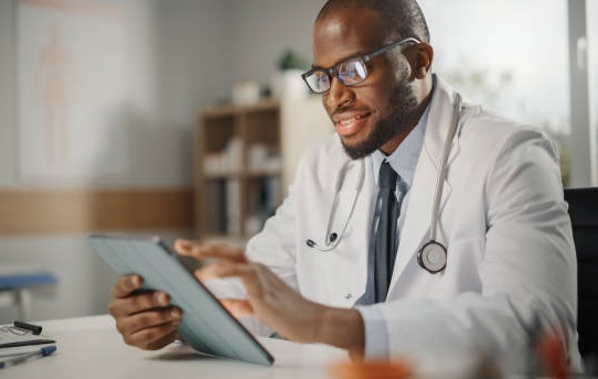 doctor looking at tablet