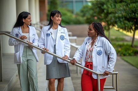 MCG students talking outside of a building