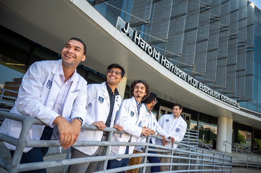 MCG students in front of the Harrison Commons building