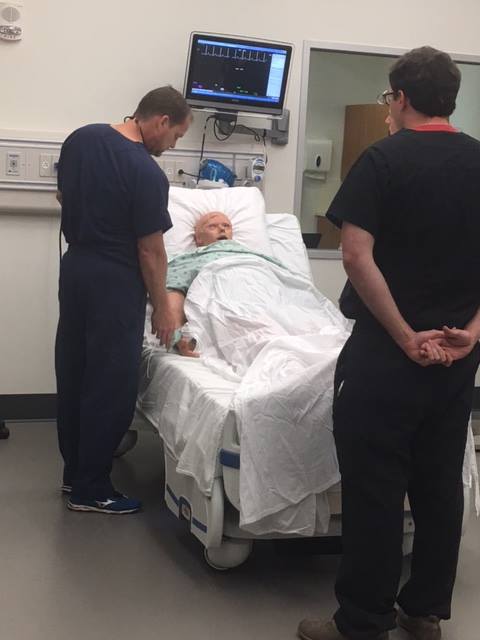 Residents work with a Manikin