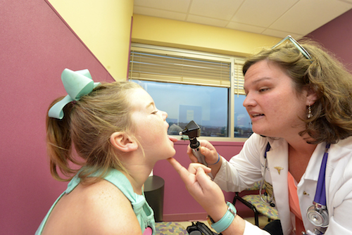 Child getting a checkup.