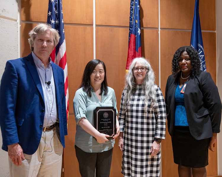 FS award ceremony people posing for photo- Dr. Lu Outstanding Faculty Award