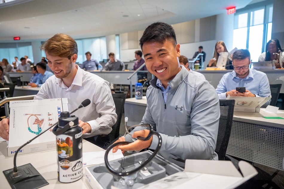 Two medical students smile for camera