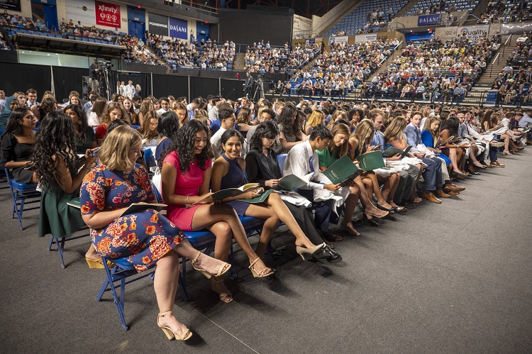 Group of young adults sitting at White Coat Class of 2027