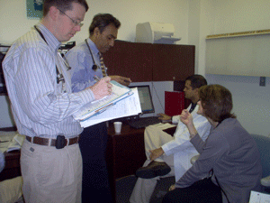 Photo of trainees working with faculty 