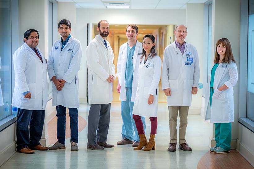 Neurology faculty walking down the hallway