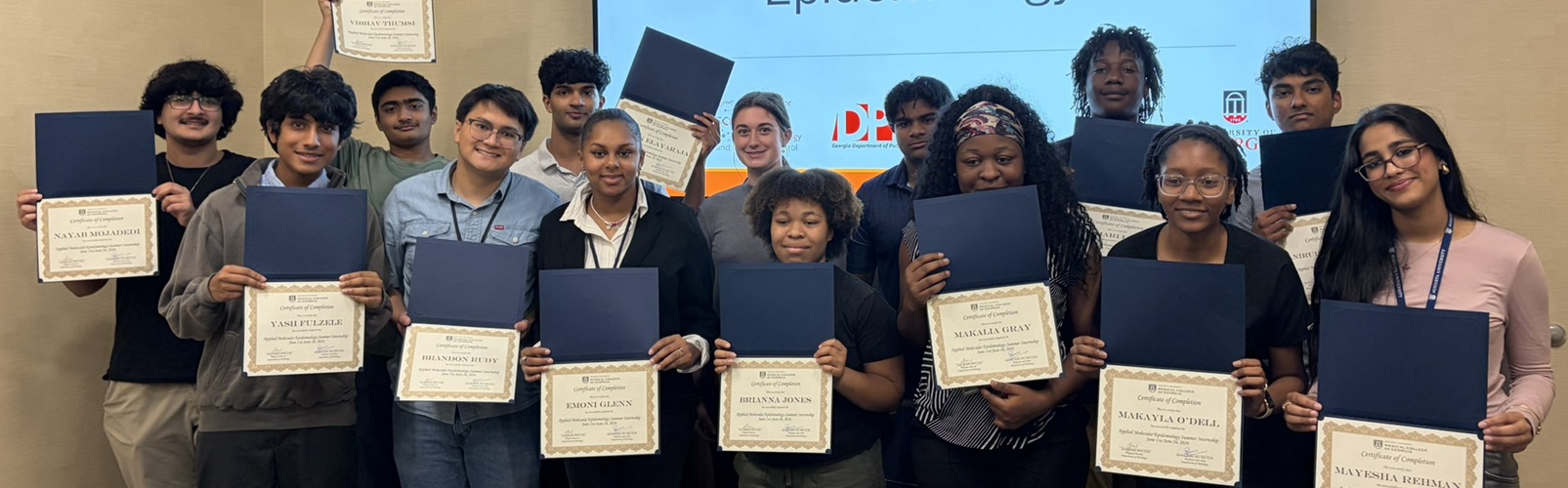Pathology lab members posing with their certificates