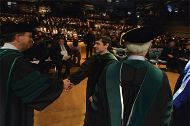 fourth year hooding ceremony