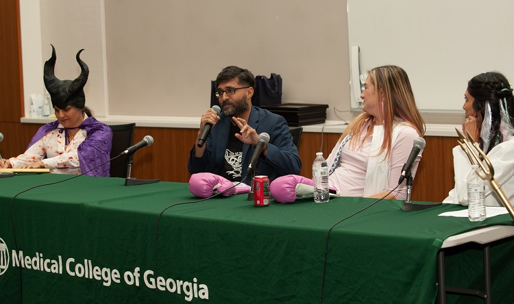 October 2023 Raft debate- people sit at table during raft debate