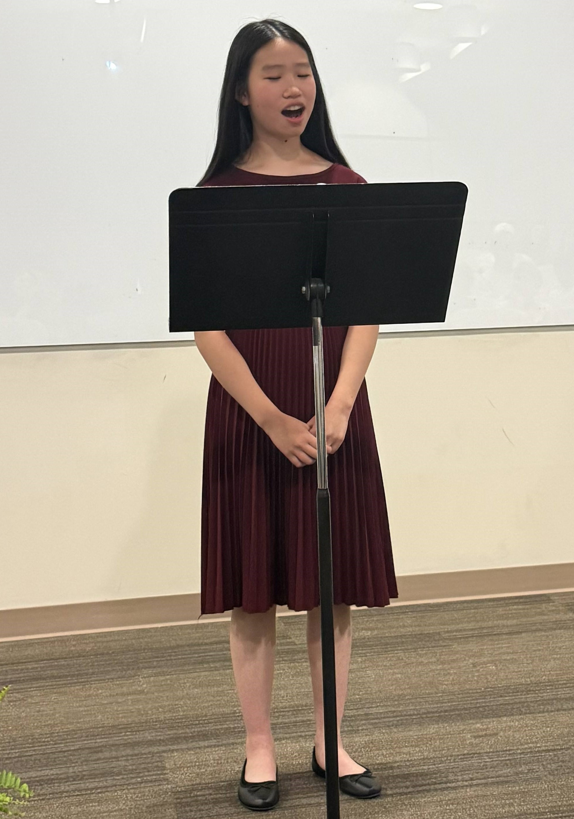 A winner reading their work 