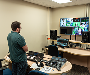 student looking at monitors