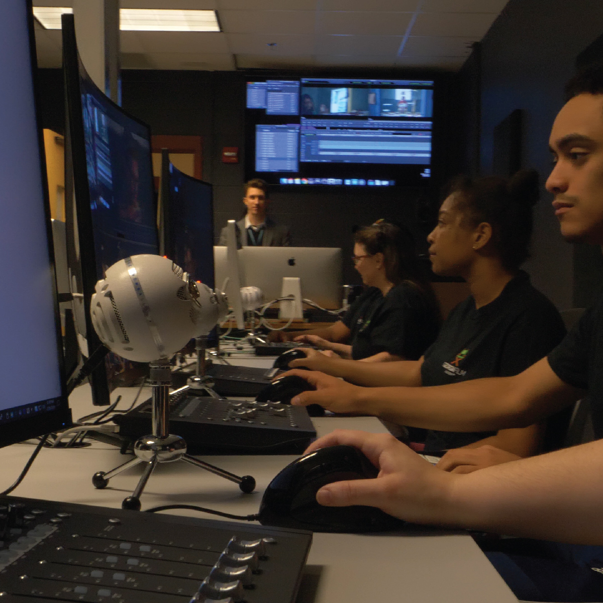 gfa student doing post production editing on a computer