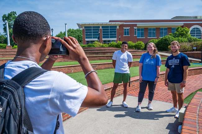 someone taking photo of other people