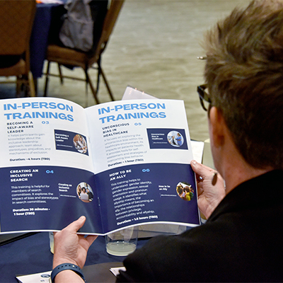 Dr. Linville looking at the ODI Training Opportunities Catalog