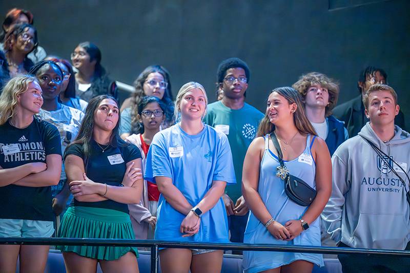 group of girls standing next to each other