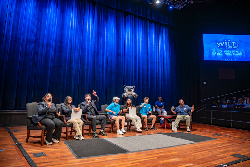 students sitting in chairs in a semi-circle shape