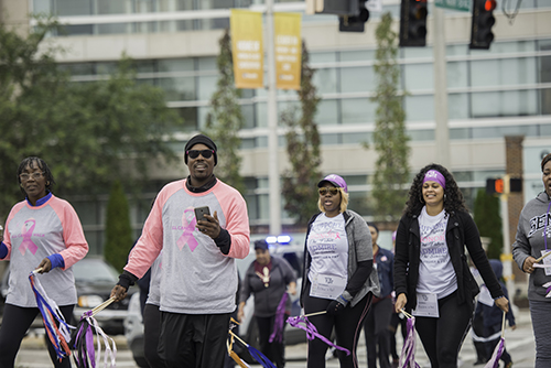walkers in pink shirts
